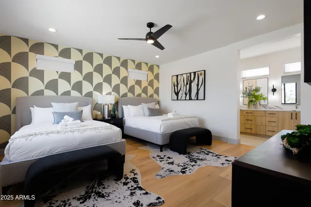 a bedroom with a bed and a couch