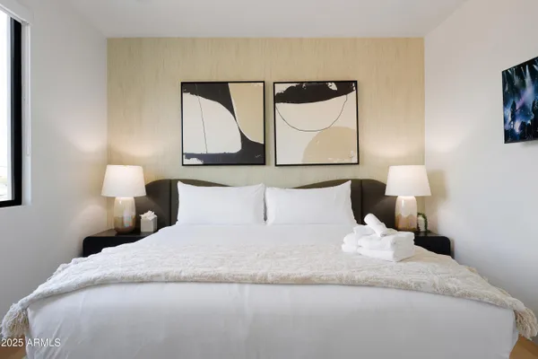 a large white bed in a white room