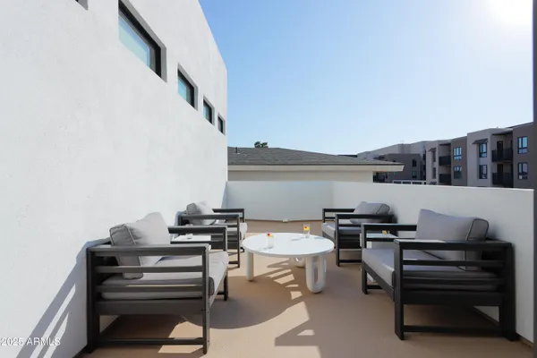 a view of a workspace with furniture