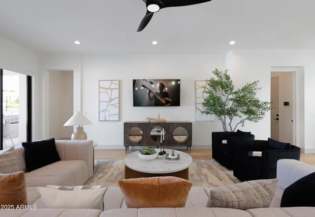 a living room with furniture and a flat screen tv
