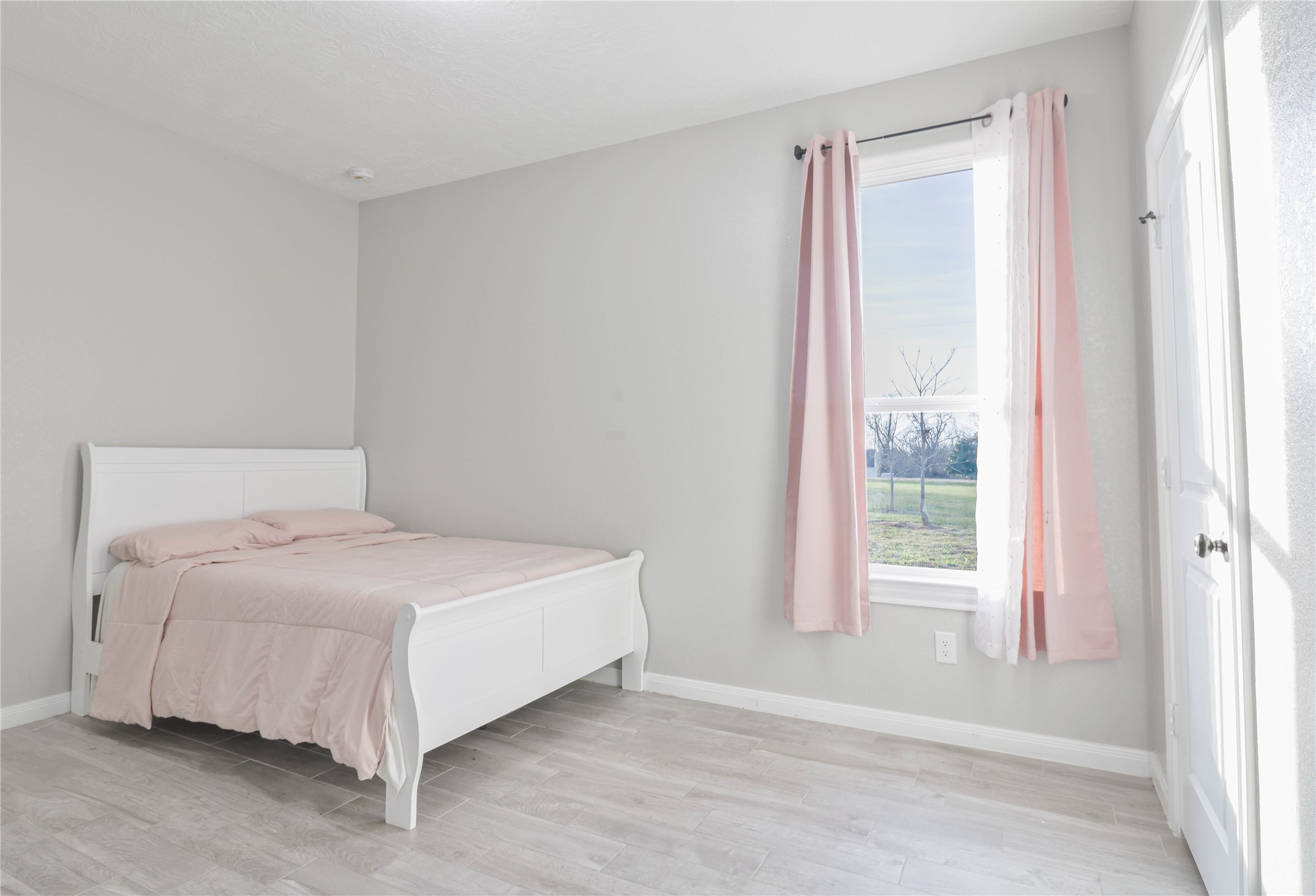 38938 Mt Zion Road Pattison, TX 77423 - Photo 12 of 15 a large bed sitting in a bedroom next to a window