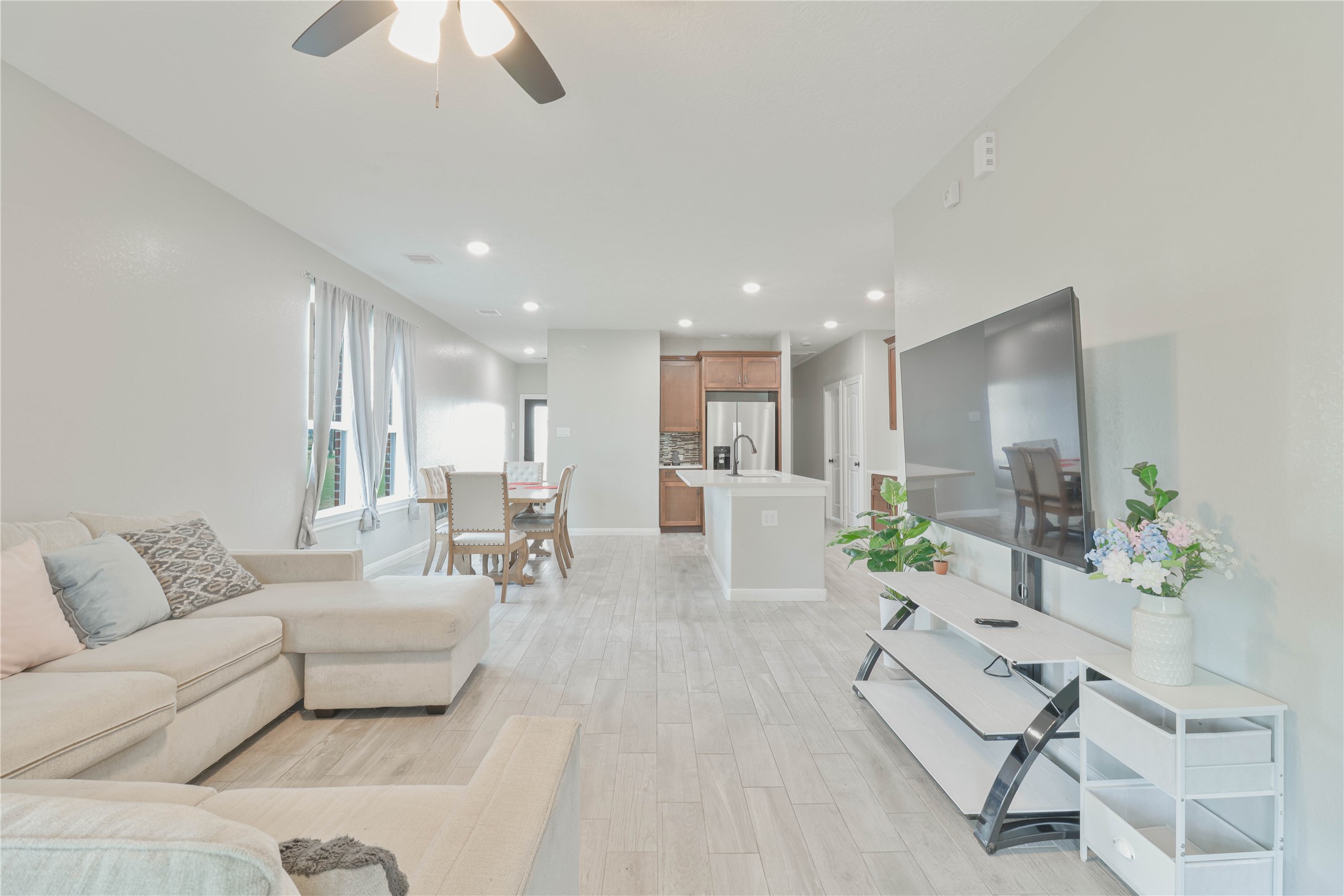 38938 Mt Zion Road Pattison, TX 77423 - Photo 6 of 15 a living room with furniture and a dining table with kitchen view