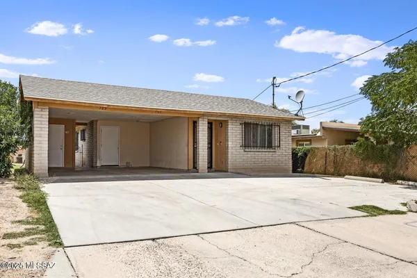 a front view of a house with a garage