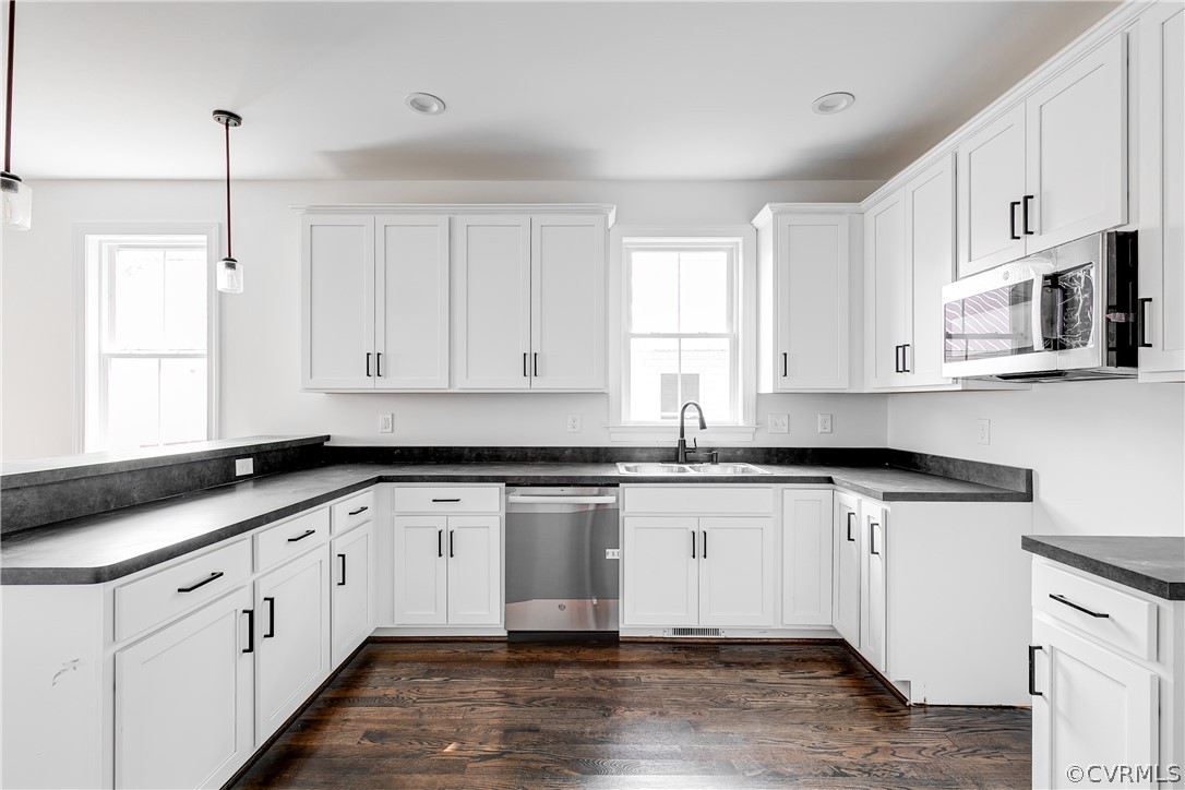 2403 Everett Street Richmond, VA 23224 - Photo 12 of 25 a kitchen with granite countertop white cabinets white appliances and a sink