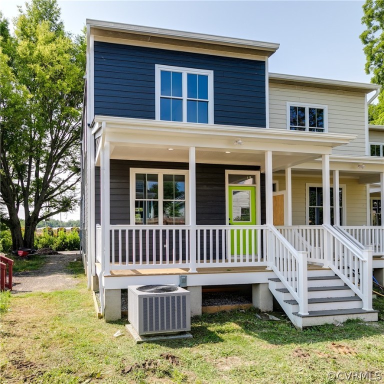 2403 Everett Street Richmond, VA 23224 - Photo 25 of 25 a view of a house with a yard deck and a large tree
