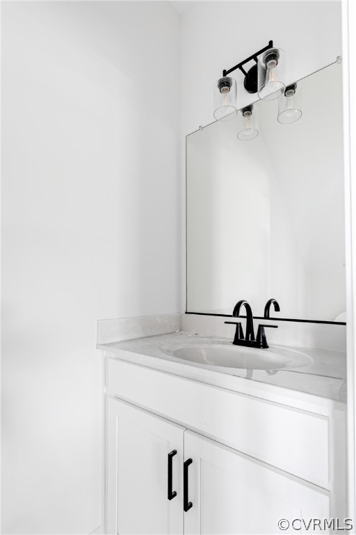 2403 Everett Street Richmond, VA 23224 - Photo 6 of 25 a bathroom with a sink and mirror