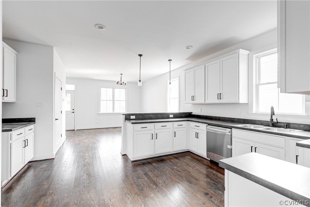 2403 Everett Street Richmond, VA 23224 - Photo 7 of 25 a kitchen with granite countertop white cabinets and white appliances
