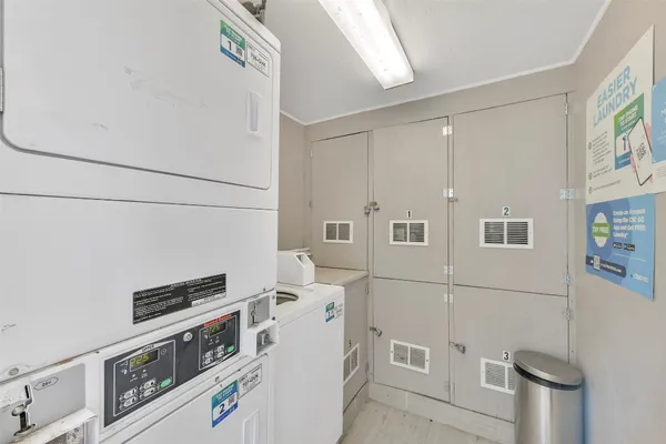 a kitchen with a refrigerator and a stove