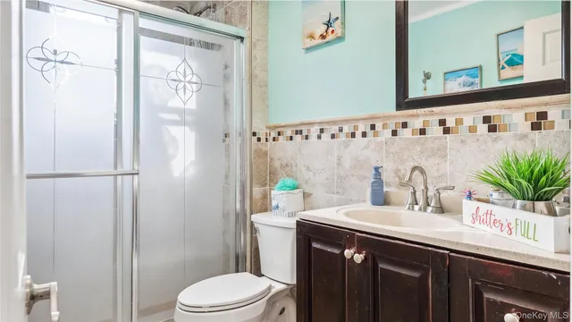 a bathroom with a toilet and a sink