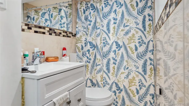 a bathroom with a sink and a washer dryer