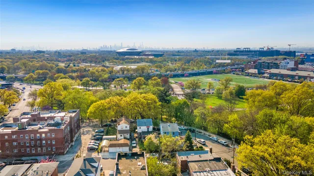 an aerial view of houses with yard