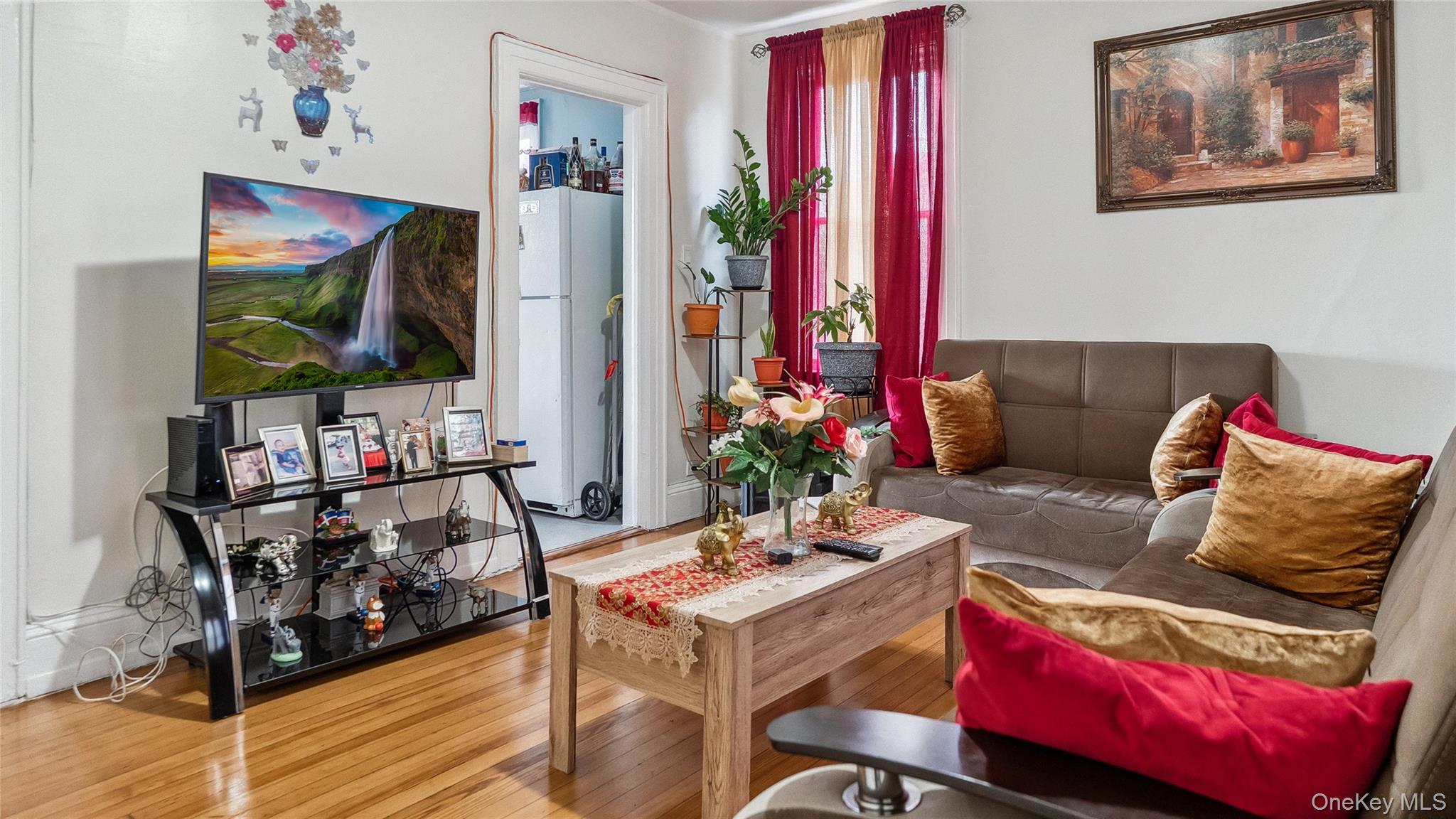 56-12 135th Street Queens, NY 11355 - Photo 4 of 23 a living room with furniture and wooden floor