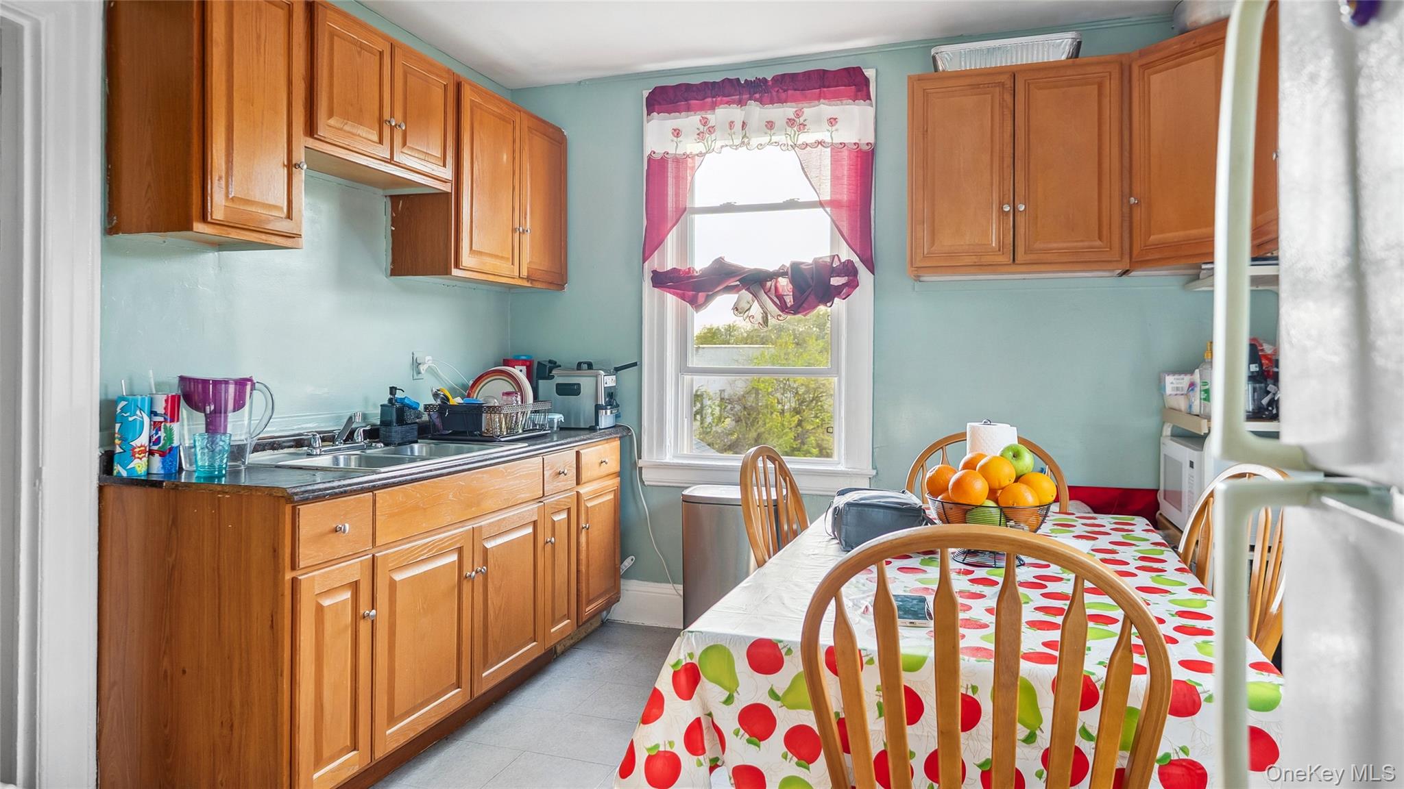 56-12 135th Street Queens, NY 11355 - Photo 7 of 23 a bedroom with furniture and a window