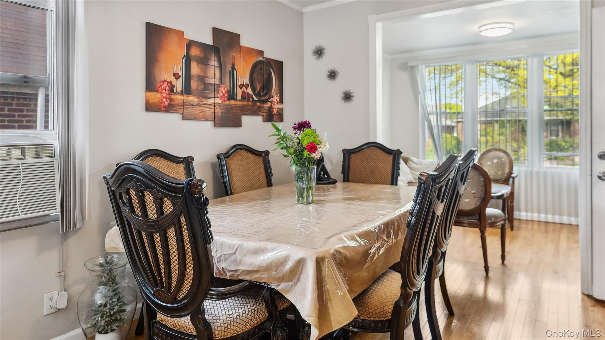 56-12 135th Street Queens, NY 11355 - Photo 8 of 23 a view of a dining room with furniture window and wooden floor