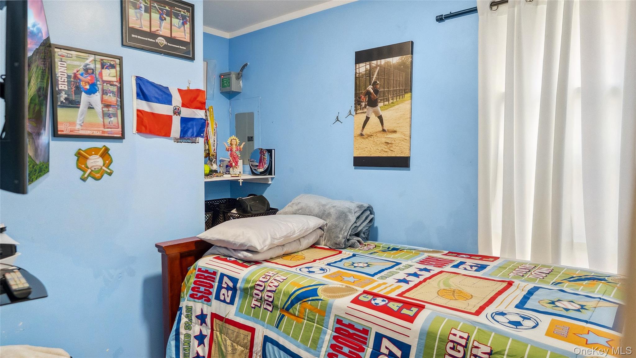 56-12 135th Street Queens, NY 11355 - Photo 10 of 23 a bedroom with bed and wooden floor