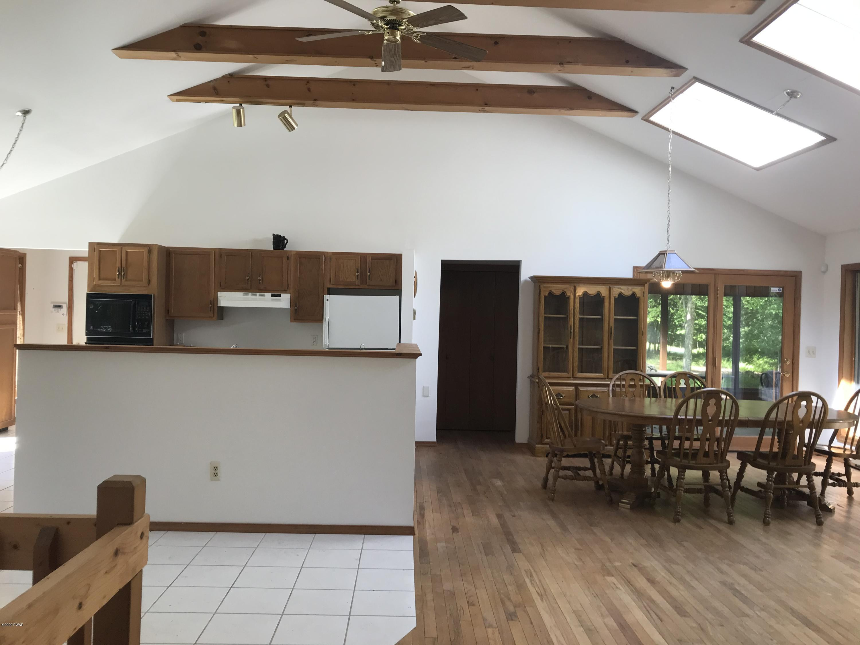 183 Yale Road Milford, PA 18337 - Photo 26 of 26 a dining room with furniture and wooden floor