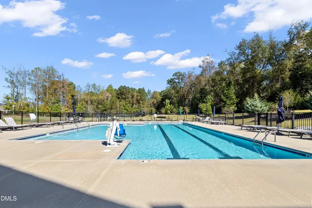 a view of a swimming pool with an outdoor seating