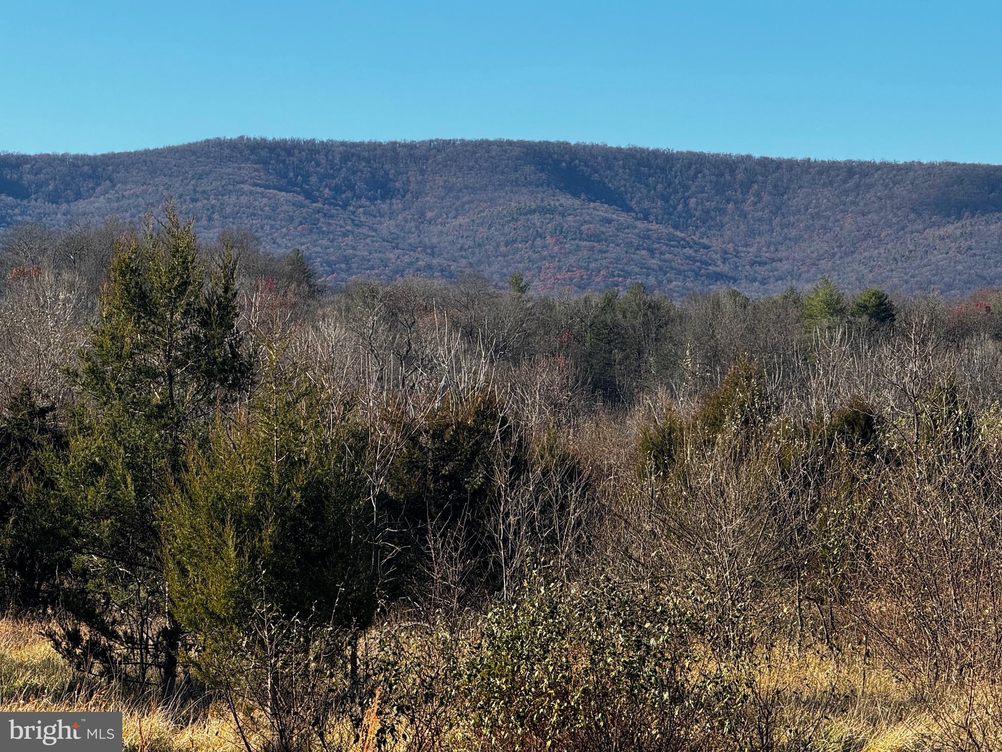 a view of mountains and valleys