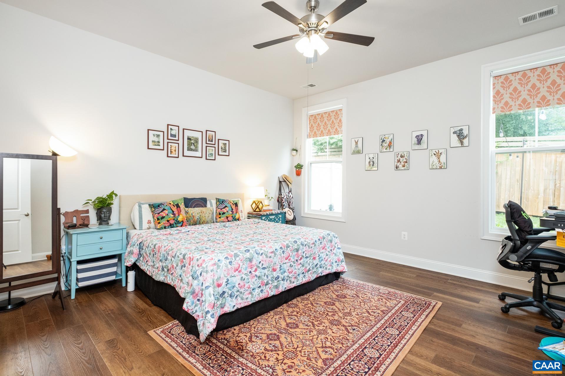 3232 Bergen Street Charlottesville, VA 22902 - Photo 11 of 31 a bedroom with a bed and a table in it