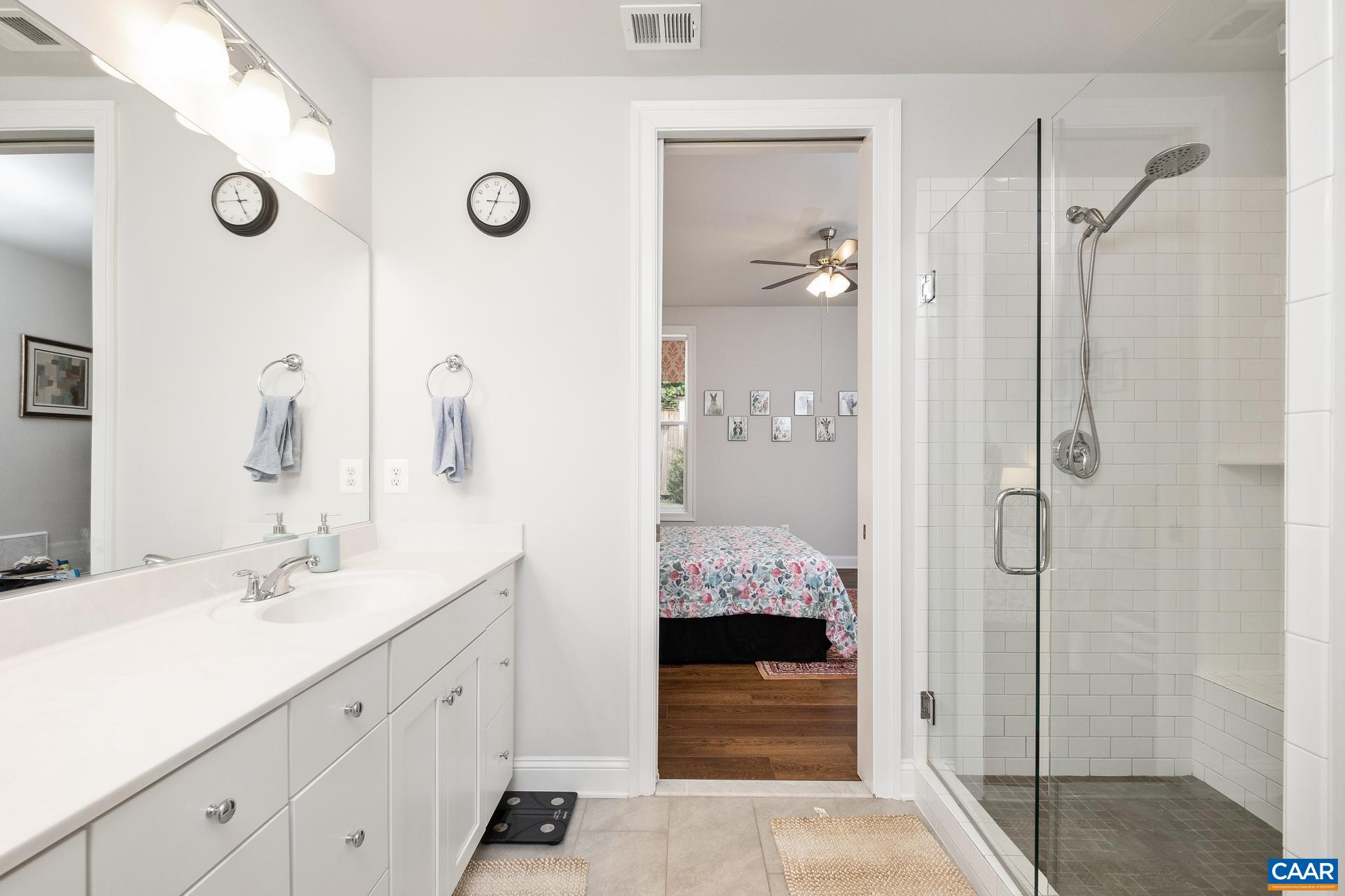 3232 Bergen Street Charlottesville, VA 22902 - Photo 12 of 31 a bathroom with a shower sink and mirror