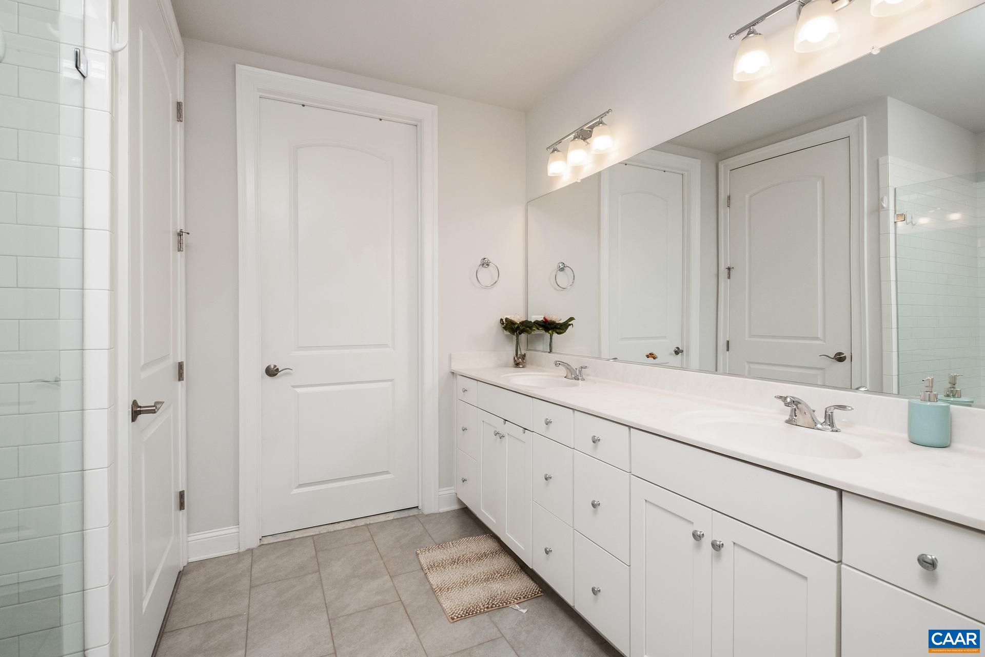 3232 Bergen Street Charlottesville, VA 22902 - Photo 13 of 31 a bathroom with a sink and a mirror