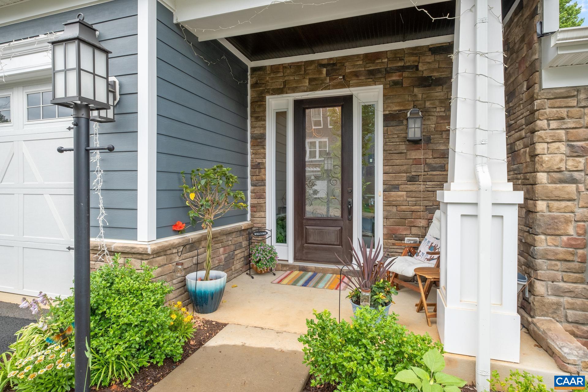 3232 Bergen Street Charlottesville, VA 22902 - Photo 2 of 31 front view of a house with a potted plant and floor to ceiling windows