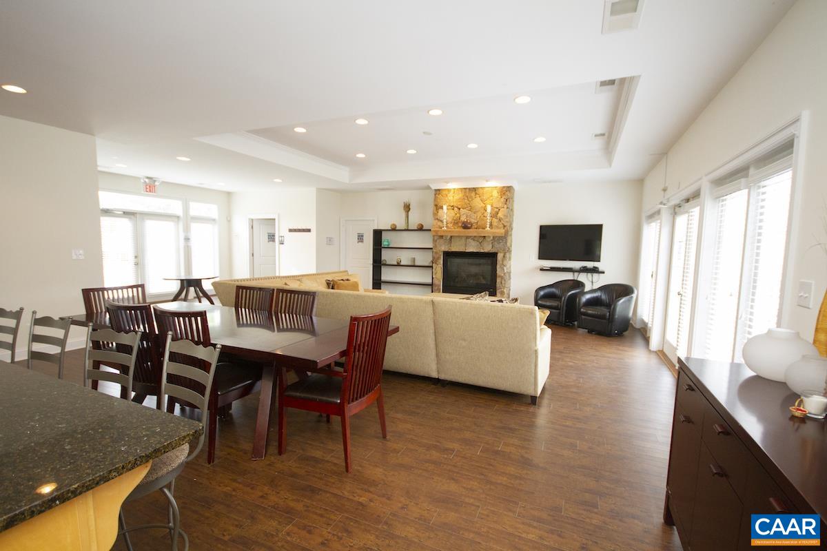 3232 Bergen Street Charlottesville, VA 22902 - Photo 23 of 31 a living room with furniture flat screen tv and wooden floor