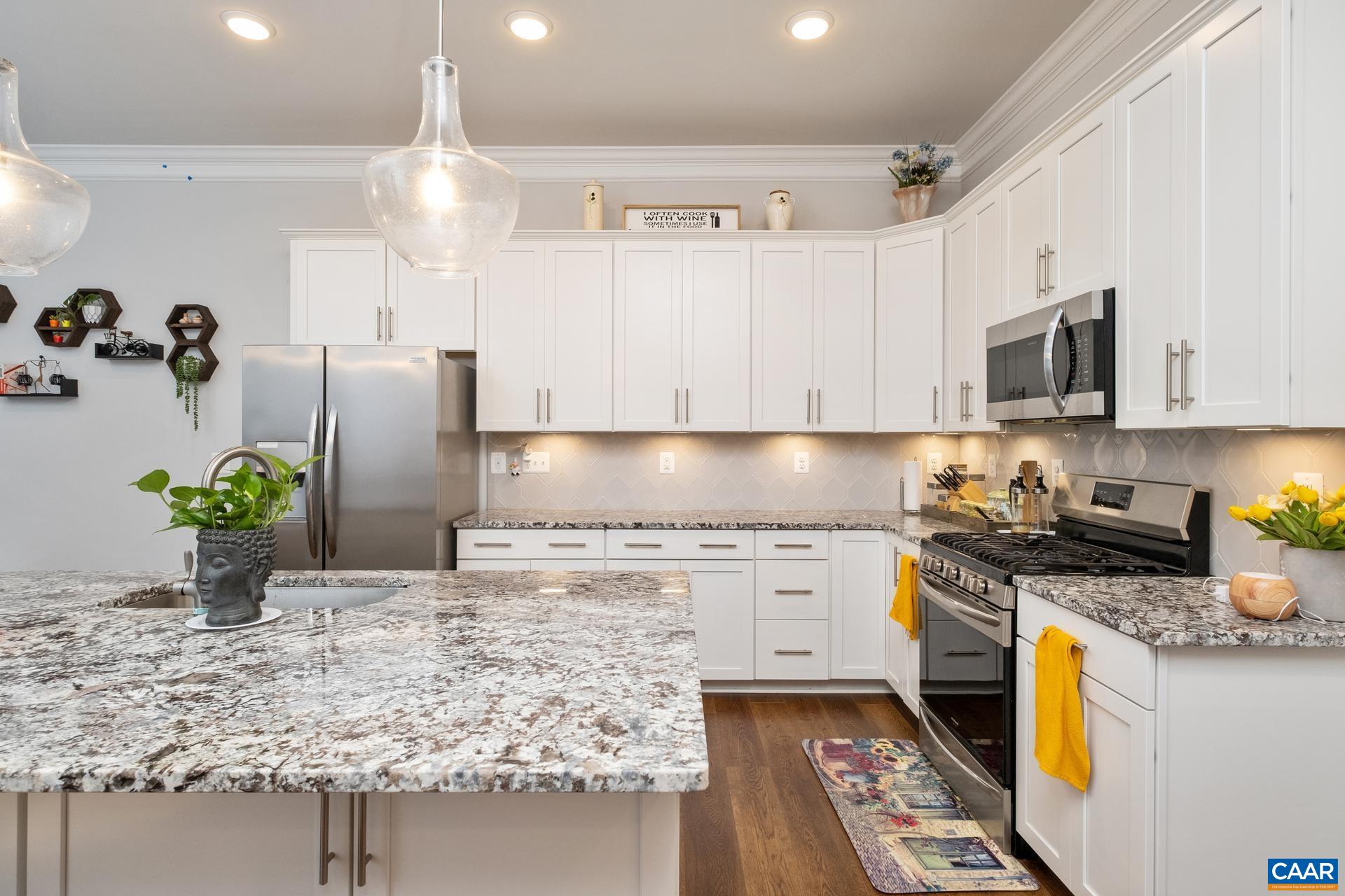3232 Bergen Street Charlottesville, VA 22902 - Photo 5 of 31 a kitchen with stainless steel appliances granite countertop a sink a stove and a refrigerator
