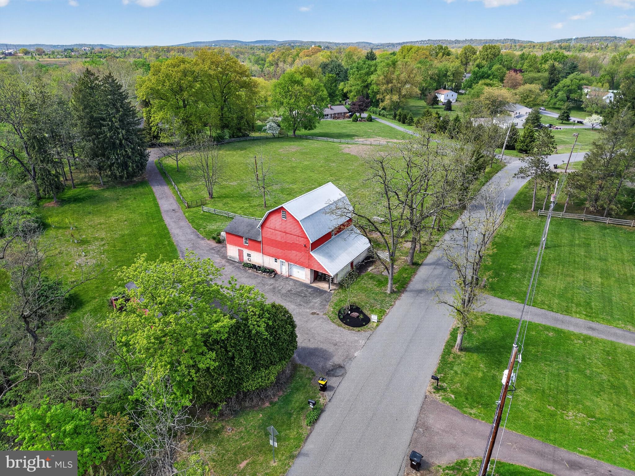 300 Sanatoga Road Pottstown, PA 19465 - Photo 68 of 79 Charming red barn amidst lush greenery.