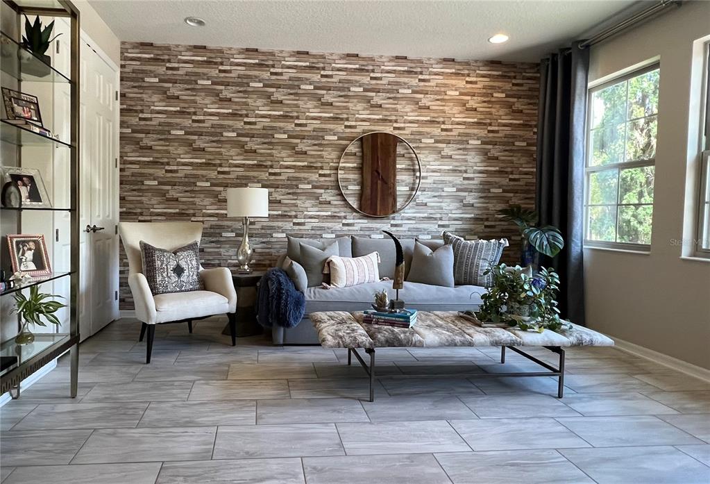 714 Riviera Bella Drive DeBary, FL 32713 - Photo 11 of 50 a living room with furniture and a fireplace