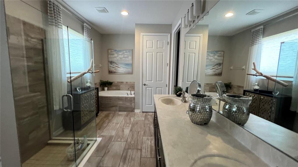 714 Riviera Bella Drive DeBary, FL 32713 - Photo 26 of 50 a living room with furniture a large window and stainless steel appliances