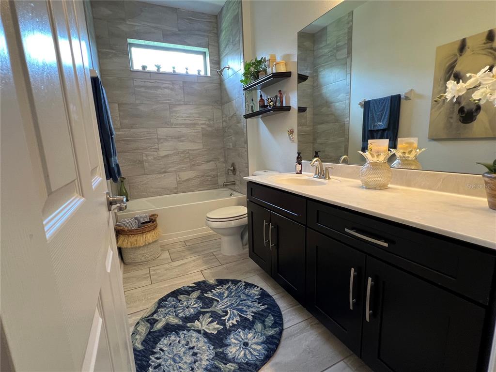 714 Riviera Bella Drive DeBary, FL 32713 - Photo 31 of 50 a bathroom with a sink and a mirror