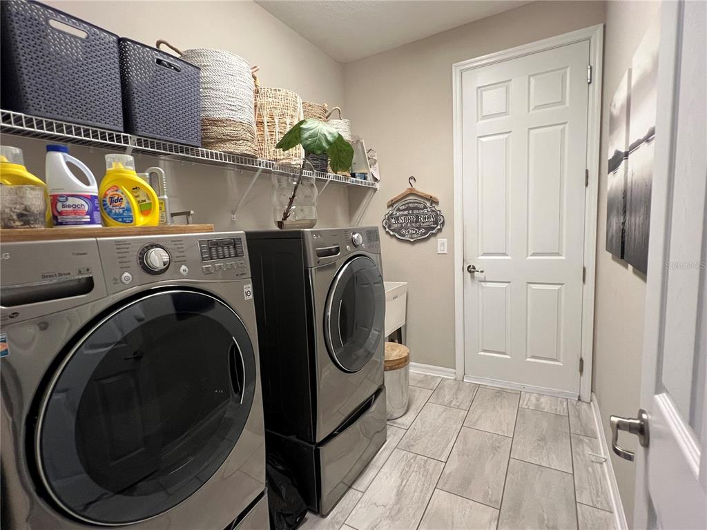 714 Riviera Bella Drive DeBary, FL 32713 - Photo 35 of 50 a utility room with dryer and washer