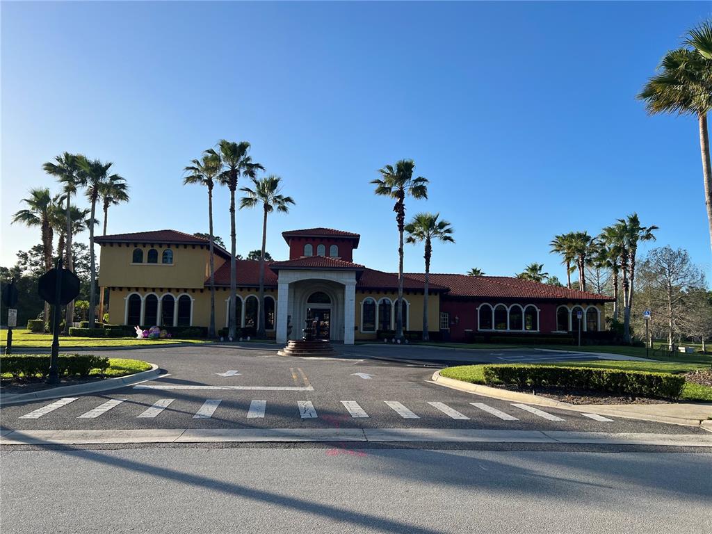 714 Riviera Bella Drive DeBary, FL 32713 - Photo 38 of 50 a view of a large pool with lawn chairs under an umbrella