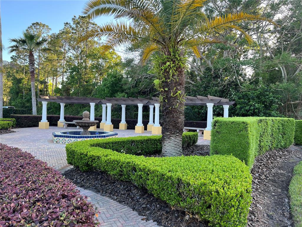714 Riviera Bella Drive DeBary, FL 32713 - Photo 42 of 50 a view of a house with backyard sitting area and garden