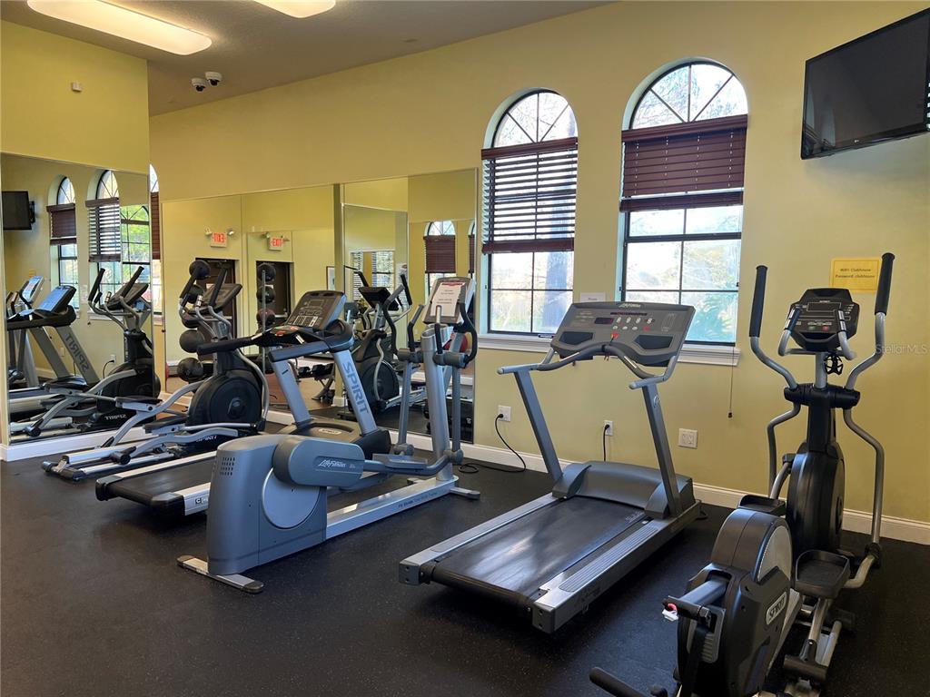 714 Riviera Bella Drive DeBary, FL 32713 - Photo 44 of 50 a view of a room with gym equipment