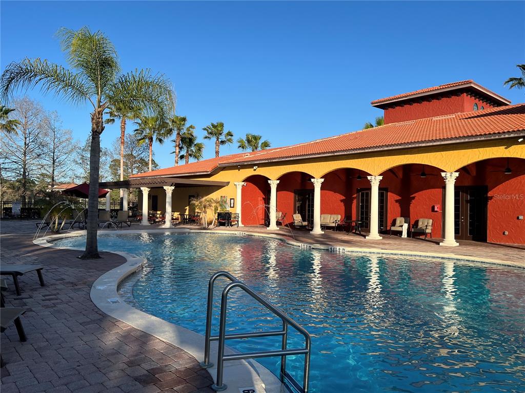 714 Riviera Bella Drive DeBary, FL 32713 - Photo 47 of 50 a view of a building with pool and sitting area