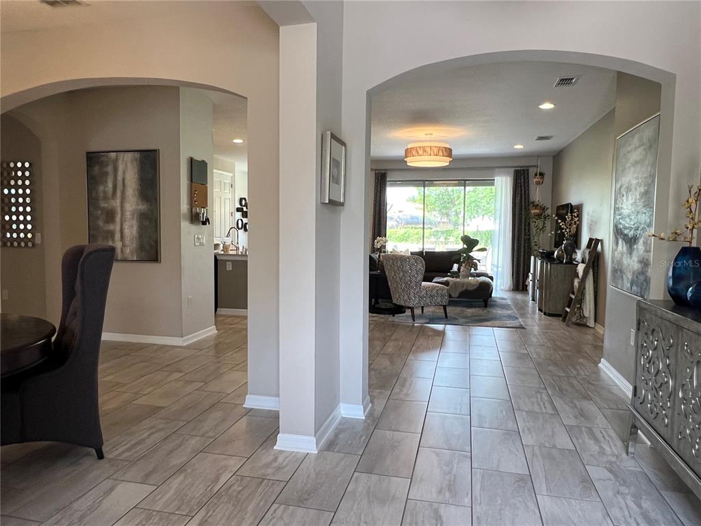 714 Riviera Bella Drive DeBary, FL 32713 - Photo 5 of 50 a view of a living room and dining room