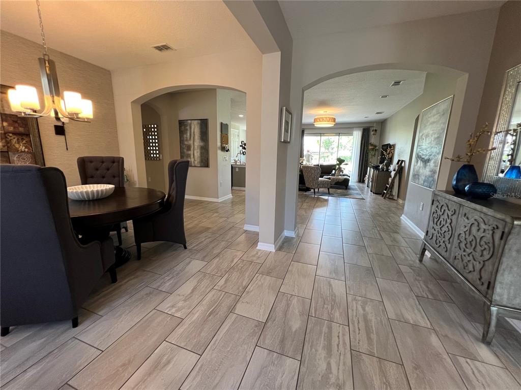 714 Riviera Bella Drive DeBary, FL 32713 - Photo 6 of 50 a view of a living room and dining room