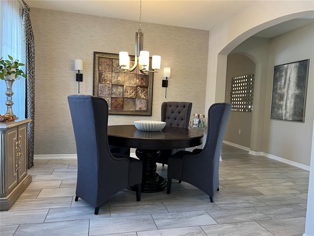714 Riviera Bella Drive DeBary, FL 32713 - Photo 7 of 50 a view of a dining room with furniture
