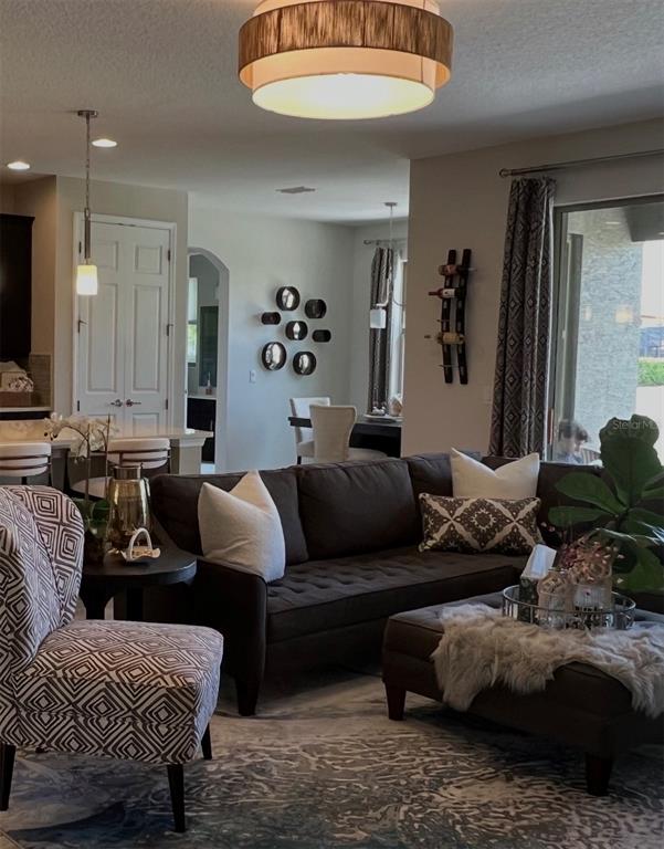714 Riviera Bella Drive DeBary, FL 32713 - Photo 9 of 50 a living room with furniture and a couch