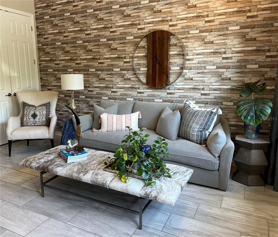 714 Riviera Bella Drive DeBary, FL 32713 - Photo 10 of 50 a living room with furniture and wooden floor
