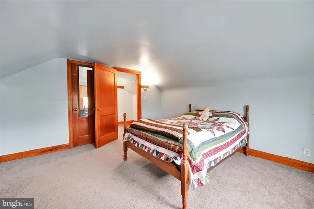 a room with a bed and a window