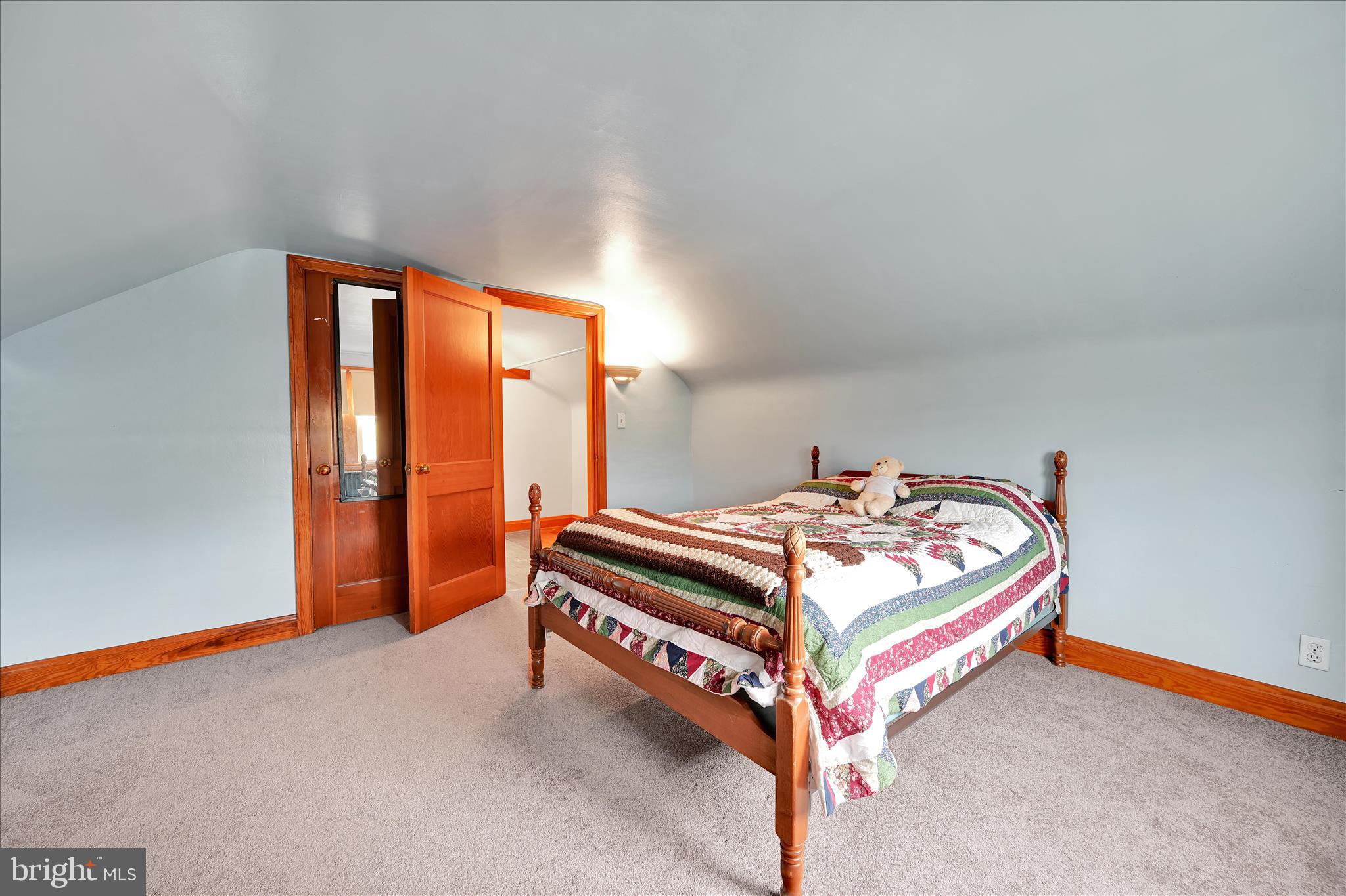 209 Ridge Road Pitman, PA 17964 - Photo 27 of 41 a room with a bed and a window