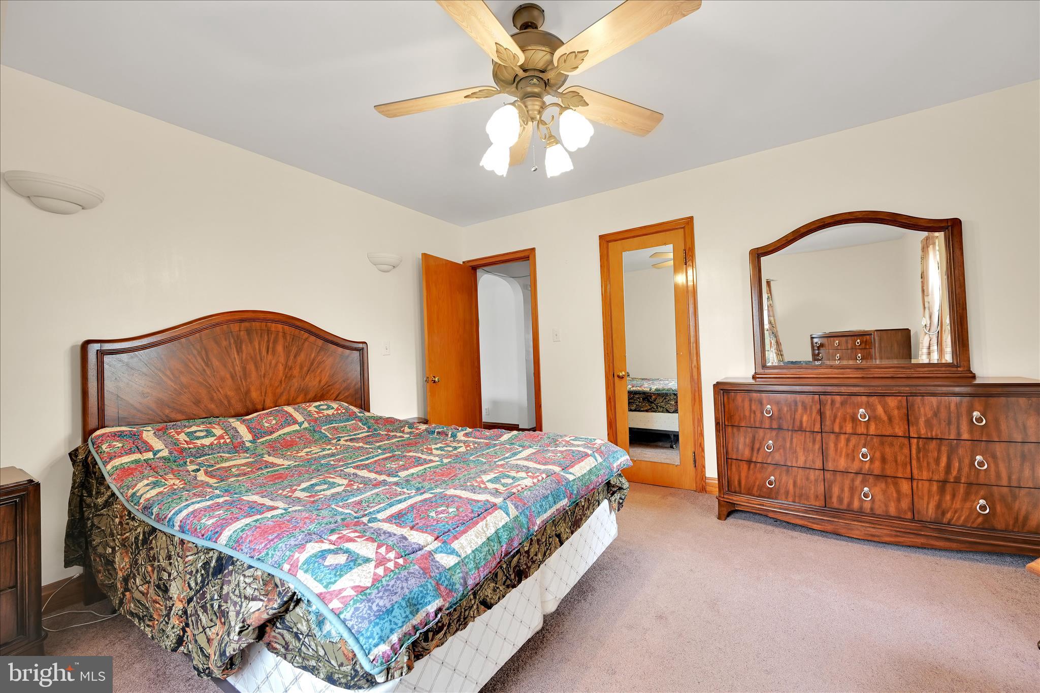 209 Ridge Road Pitman, PA 17964 - Photo 29 of 41 a bedroom with a bed and a dresser