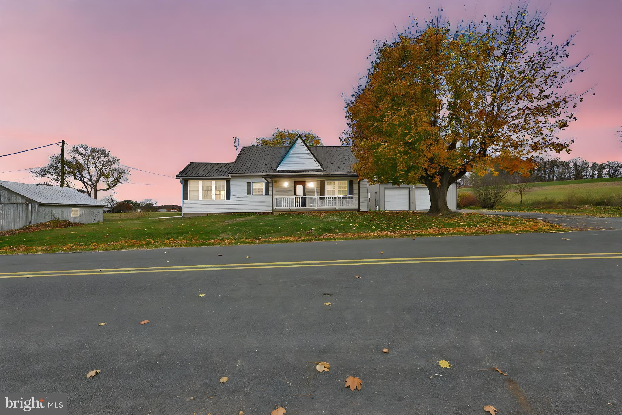 209 Ridge Road Pitman, PA 17964 - Photo 3 of 41 a front view of a house with a yard and street view