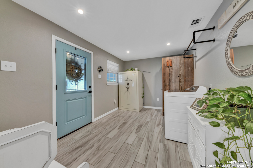 15592 Miller Road St. Hedwig, TX 78152 - Photo 22 of 47 a view of hallway with wooden floor