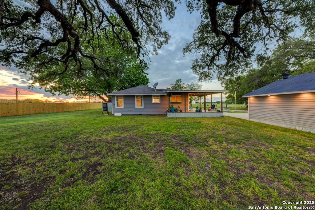 15592 Miller Road St. Hedwig, TX 78152 - Photo 26 of 47 a front view of a house with garden
