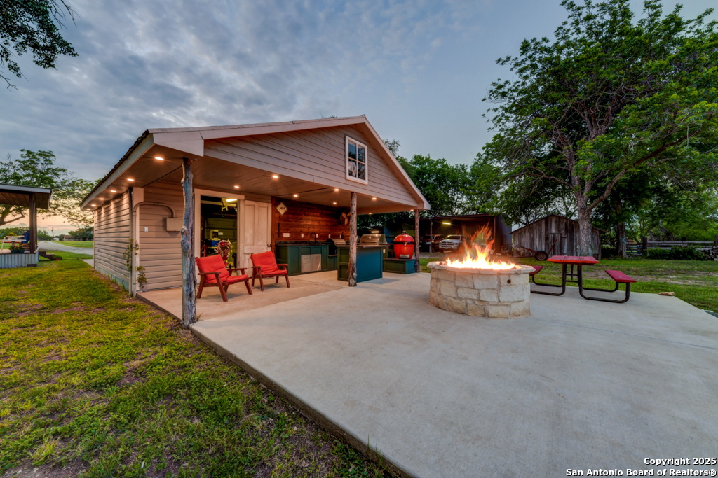 15592 Miller Road St. Hedwig, TX 78152 - Photo 28 of 47 a view of a house with backyard and sitting area