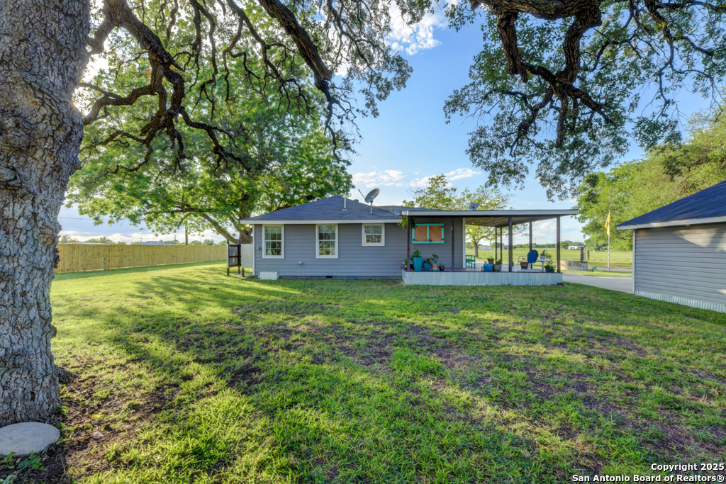 15592 Miller Road St. Hedwig, TX 78152 - Photo 33 of 47 a view of a big yard with plants and large trees